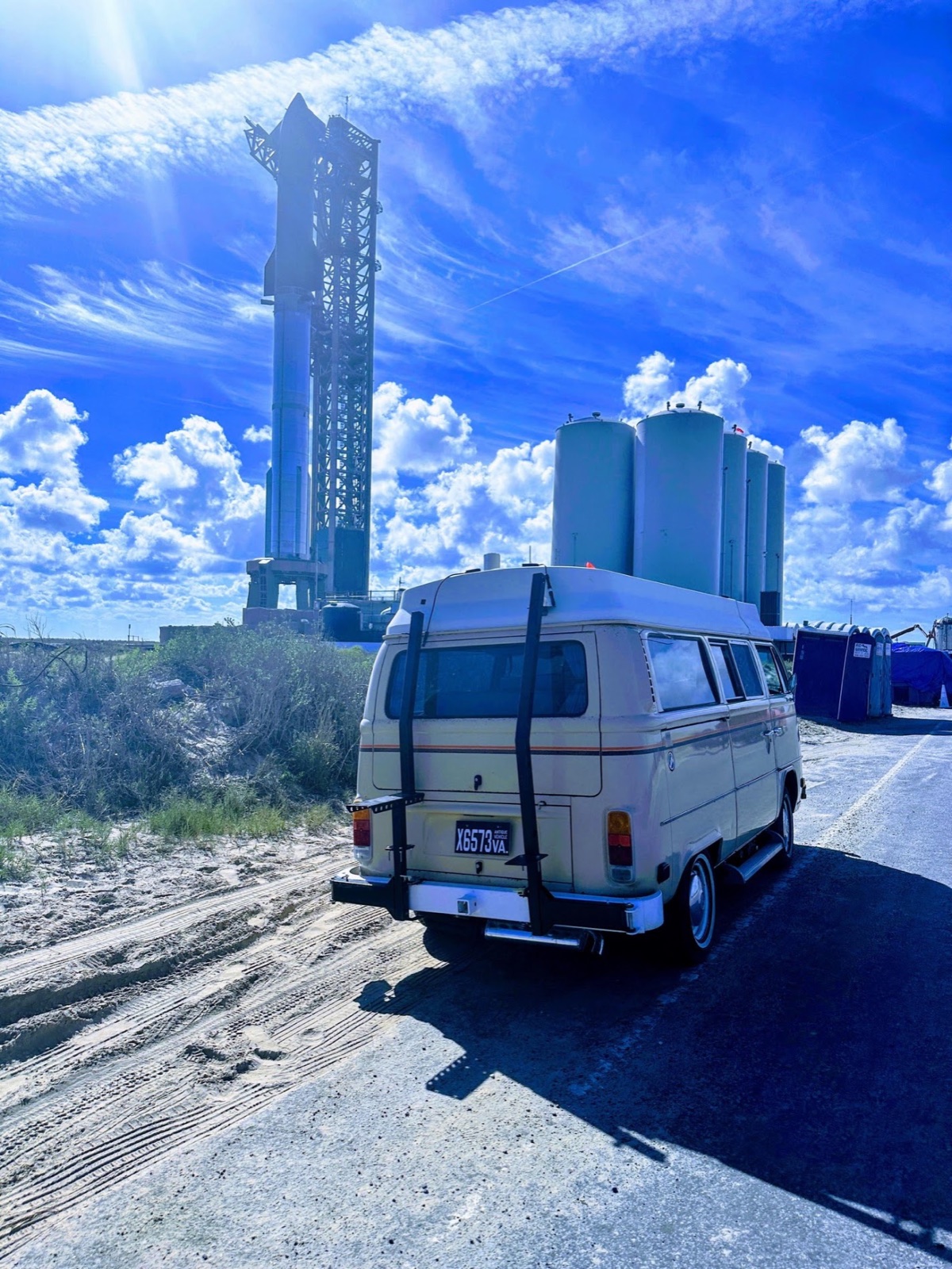 Michael’s Bus parked beside a roadside view of Starship